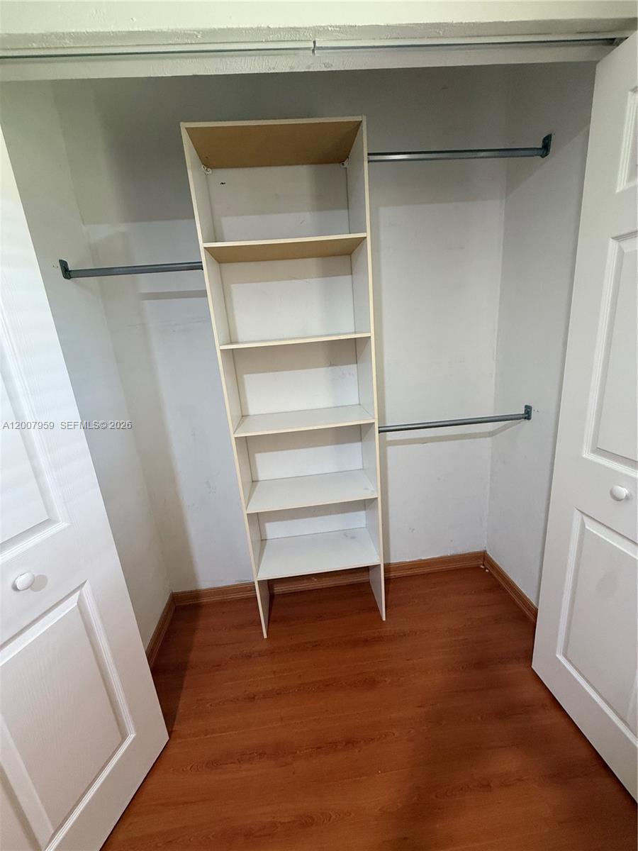 10661 Southwest 113th Place, Unit 94B Miami, FL 33176 - Photo 37 of 54 a view of an empty walk in closet