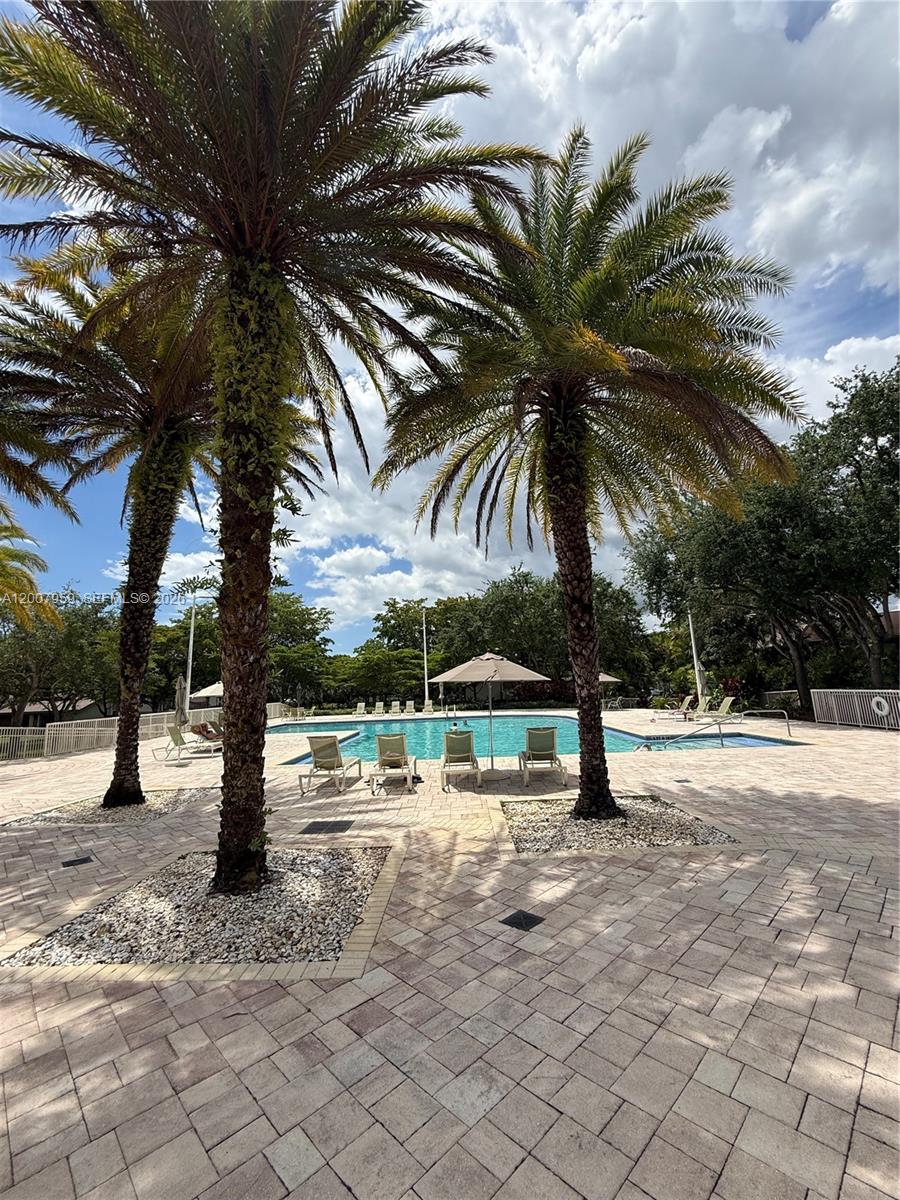 10661 Southwest 113th Place, Unit 94B Miami, FL 33176 - Photo 43 of 54 a view of outdoor space with trees
