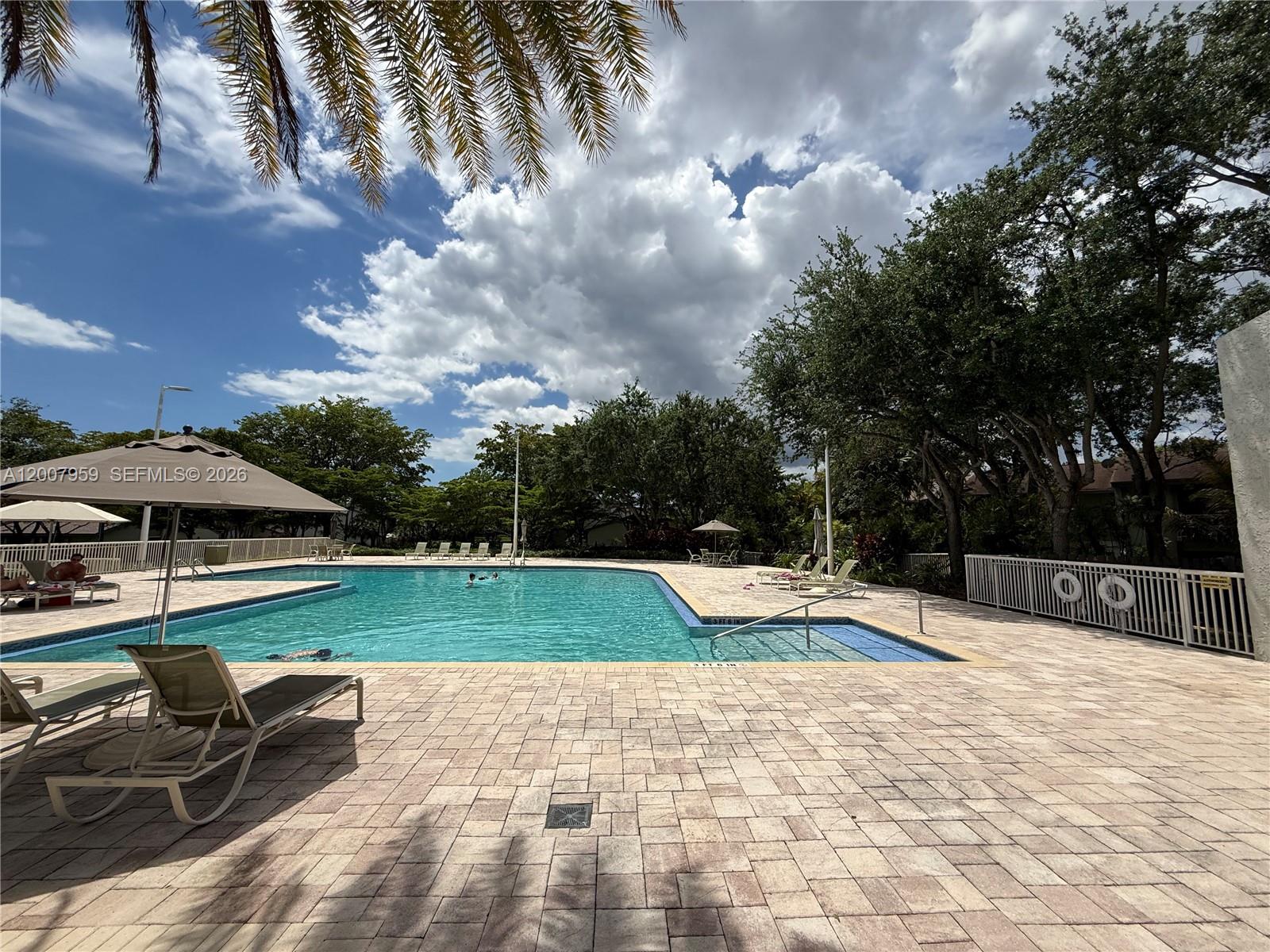 10661 Southwest 113th Place, Unit 94B Miami, FL 33176 - Photo 44 of 54 a view of outdoor space with swimming pool