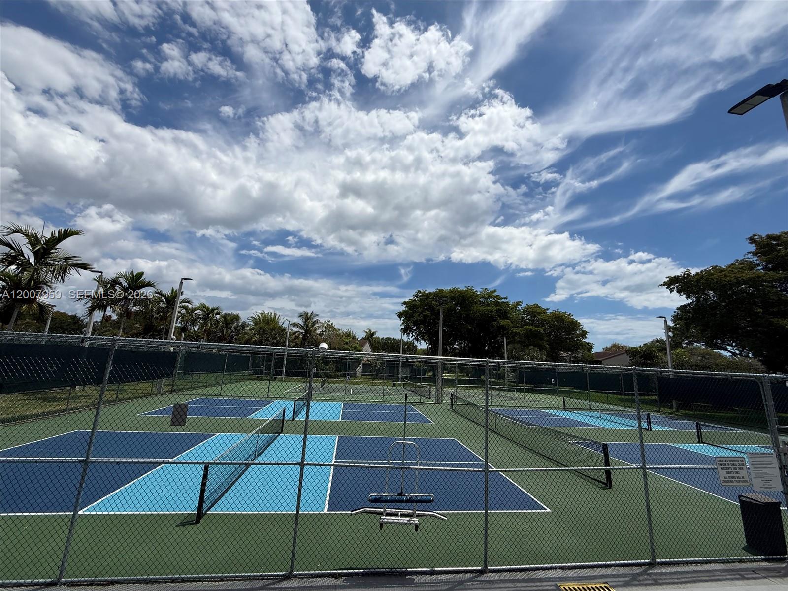 10661 Southwest 113th Place, Unit 94B Miami, FL 33176 - Photo 51 of 54 a view of tennis court