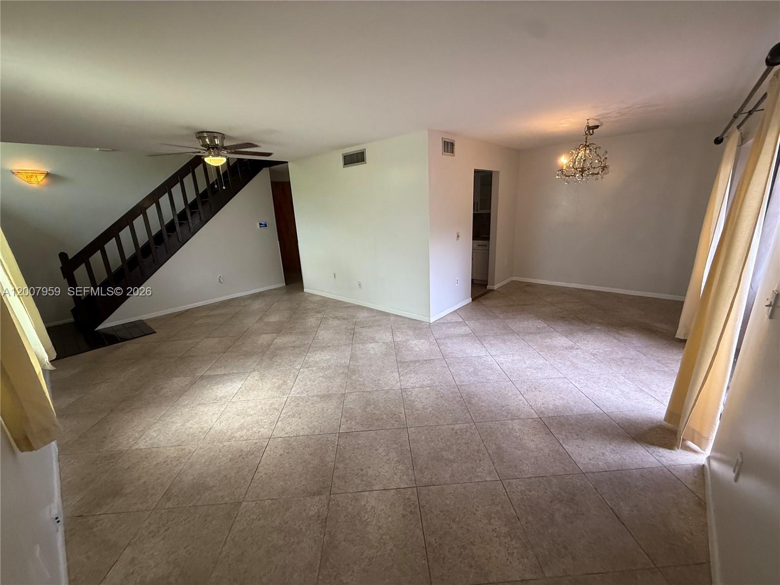 10661 Southwest 113th Place, Unit 94B Miami, FL 33176 - Photo 6 of 54 a view of hallway with stairs