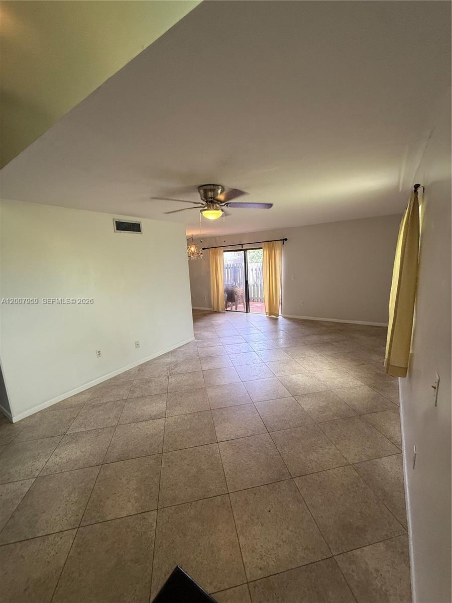 10661 Southwest 113th Place, Unit 94B Miami, FL 33176 - Photo 9 of 54 a view of an empty room and window