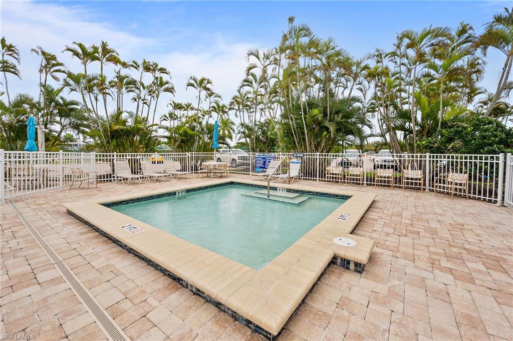 5800 Bonita Beach Road Southwest, Unit 2002 Bonita Springs, FL 34134 - Photo 21 of 24 a view of a swimming pool with a patio