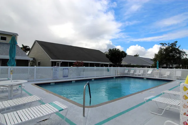a view of a swimming pool with a lounge chair