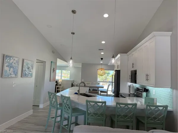a view of a kitchen and dining room