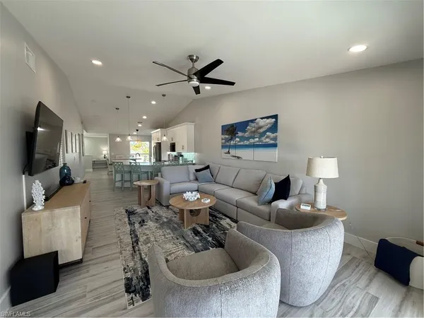 a living room with furniture and a flat screen tv