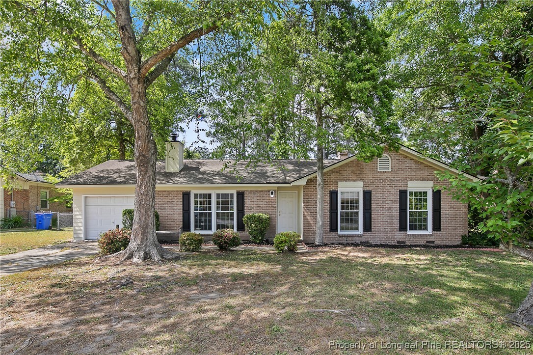 7118 Fillyaw Road Fayetteville, NC 28303 - Photo 1 of 45 a front view of house with yard and glass windows