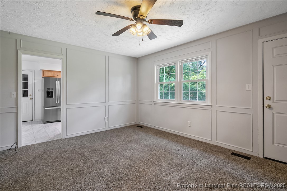 7118 Fillyaw Road Fayetteville, NC 28303 - Photo 11 of 45 wooden floor in an empty room with a window