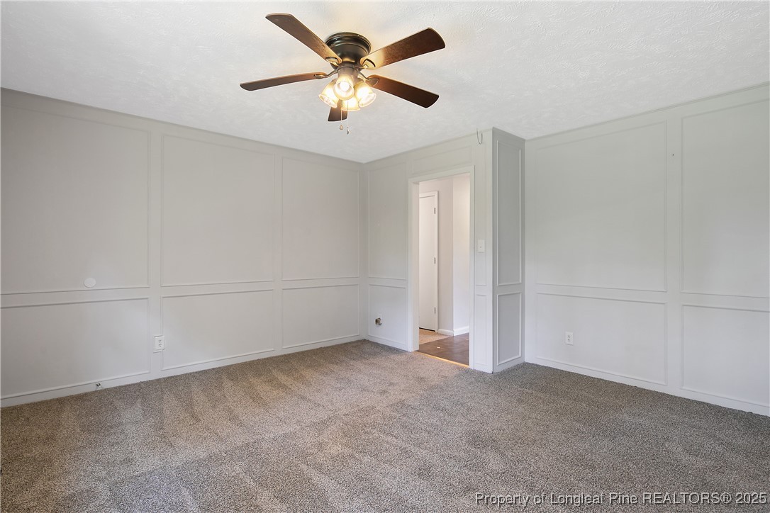 7118 Fillyaw Road Fayetteville, NC 28303 - Photo 13 of 45 an empty room with a empty space and a ceiling fan