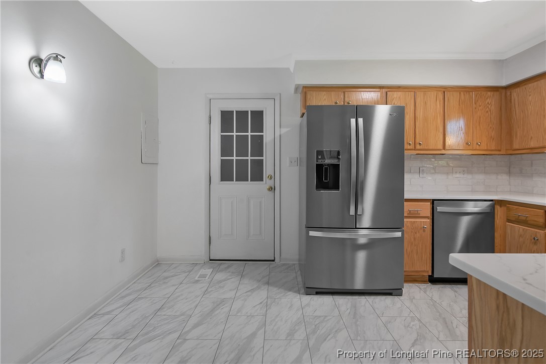 7118 Fillyaw Road Fayetteville, NC 28303 - Photo 15 of 45 a kitchen with stainless steel appliances granite countertop a refrigerator and a sink