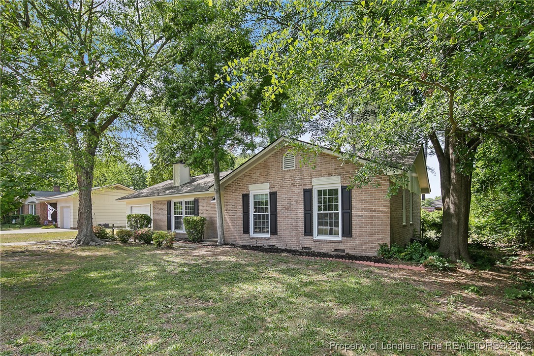 7118 Fillyaw Road Fayetteville, NC 28303 - Photo 2 of 45 a backyard of a house with table and chairs