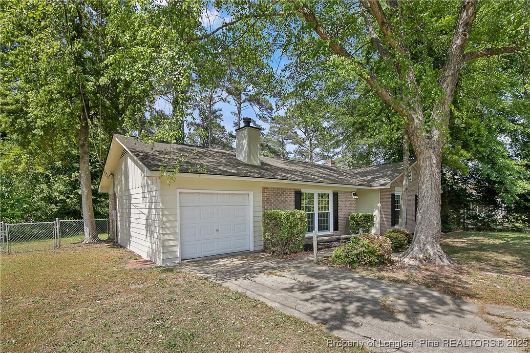 7118 Fillyaw Road Fayetteville, NC 28303 - Photo 3 of 45 front view of a house with a tree