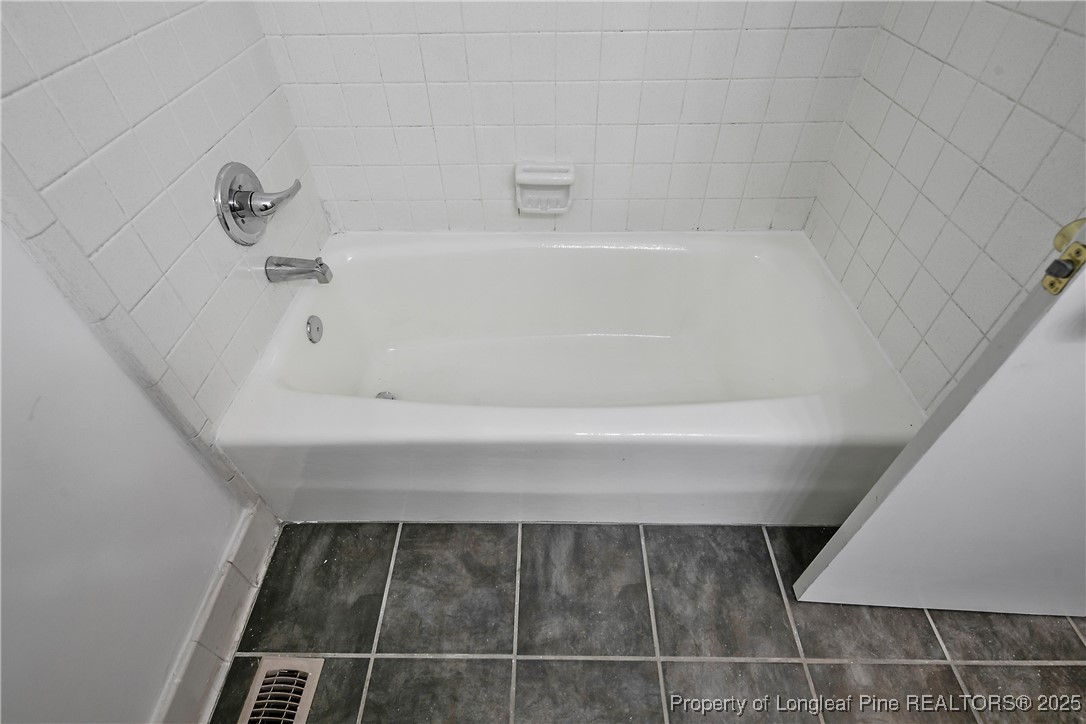 7118 Fillyaw Road Fayetteville, NC 28303 - Photo 35 of 45 a bathroom with a bathtub