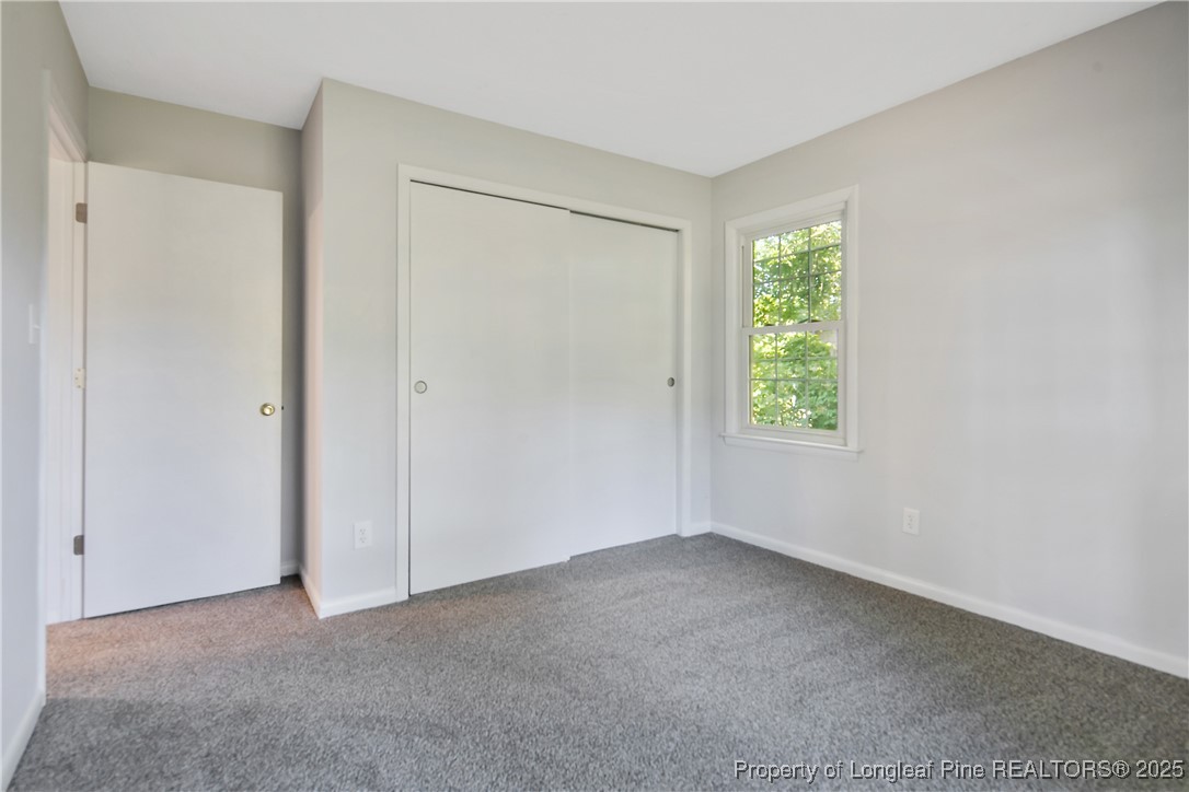 7118 Fillyaw Road Fayetteville, NC 28303 - Photo 39 of 45 an empty room with windows and closet