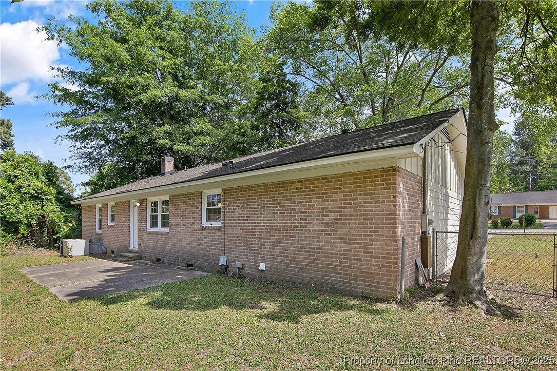 7118 Fillyaw Road Fayetteville, NC 28303 - Photo 43 of 45 a backyard of a house with lots of green space