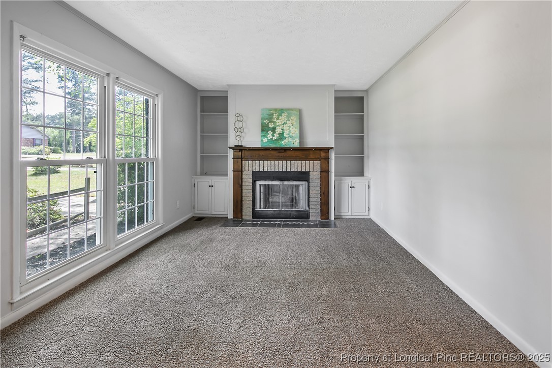 7118 Fillyaw Road Fayetteville, NC 28303 - Photo 8 of 45 a view of empty room with a fireplace
