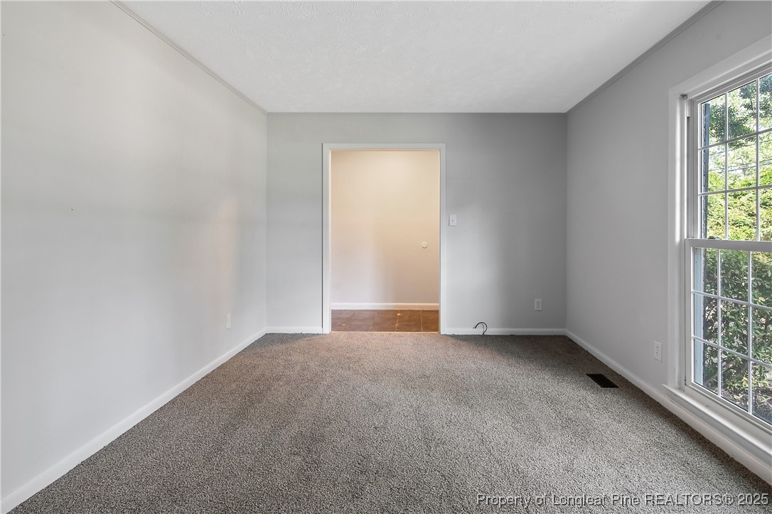 7118 Fillyaw Road Fayetteville, NC 28303 - Photo 10 of 45 an empty room with windows