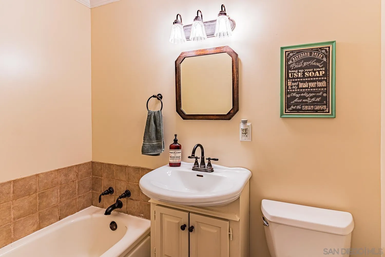9213 Dalehurst Road Santee, CA 92071 - Photo 13 of 31 a bathroom with a sink a toilet and shower