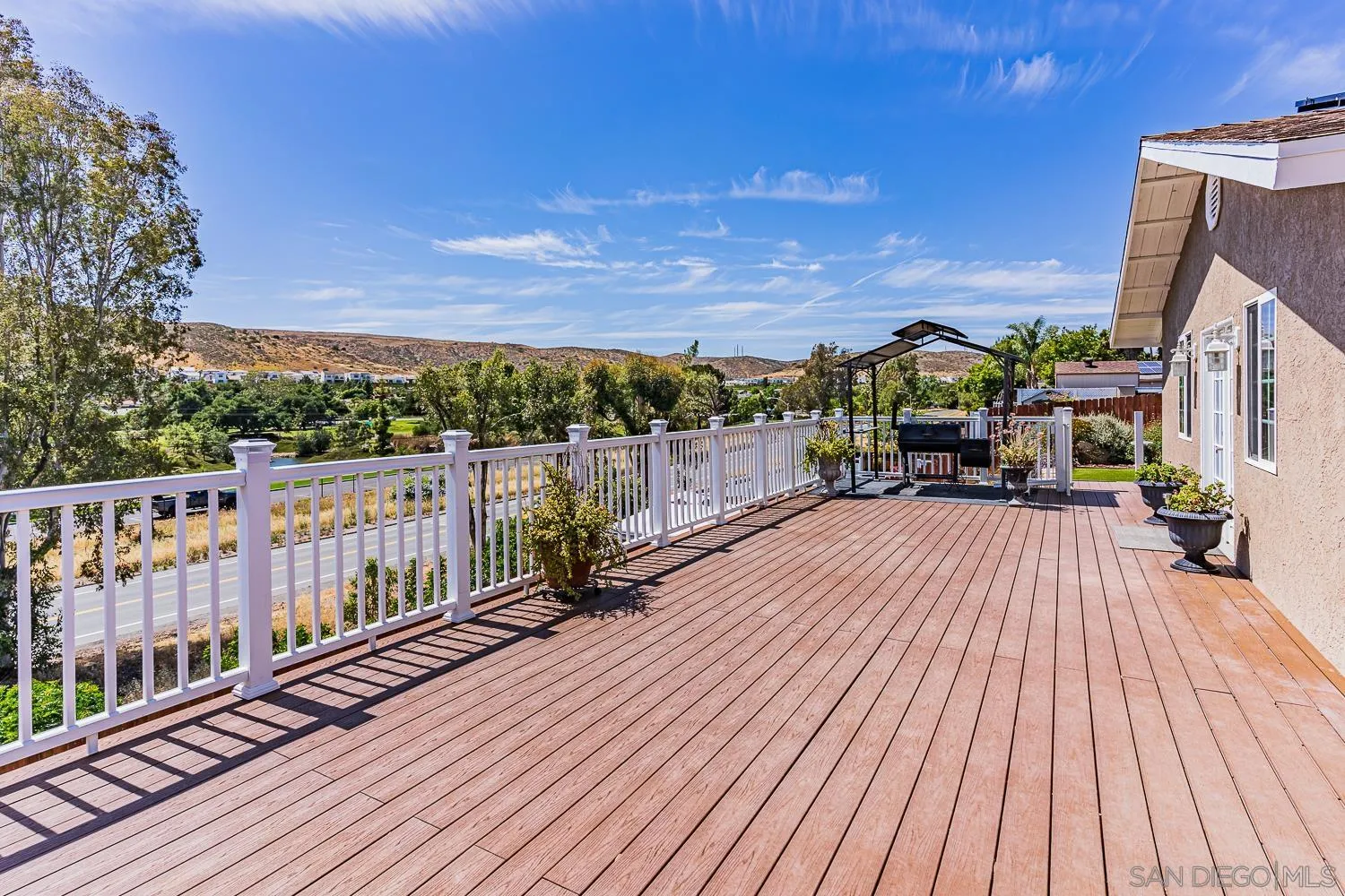 9213 Dalehurst Road Santee, CA 92071 - Photo 15 of 31 a view of a balcony with wooden floor and city view