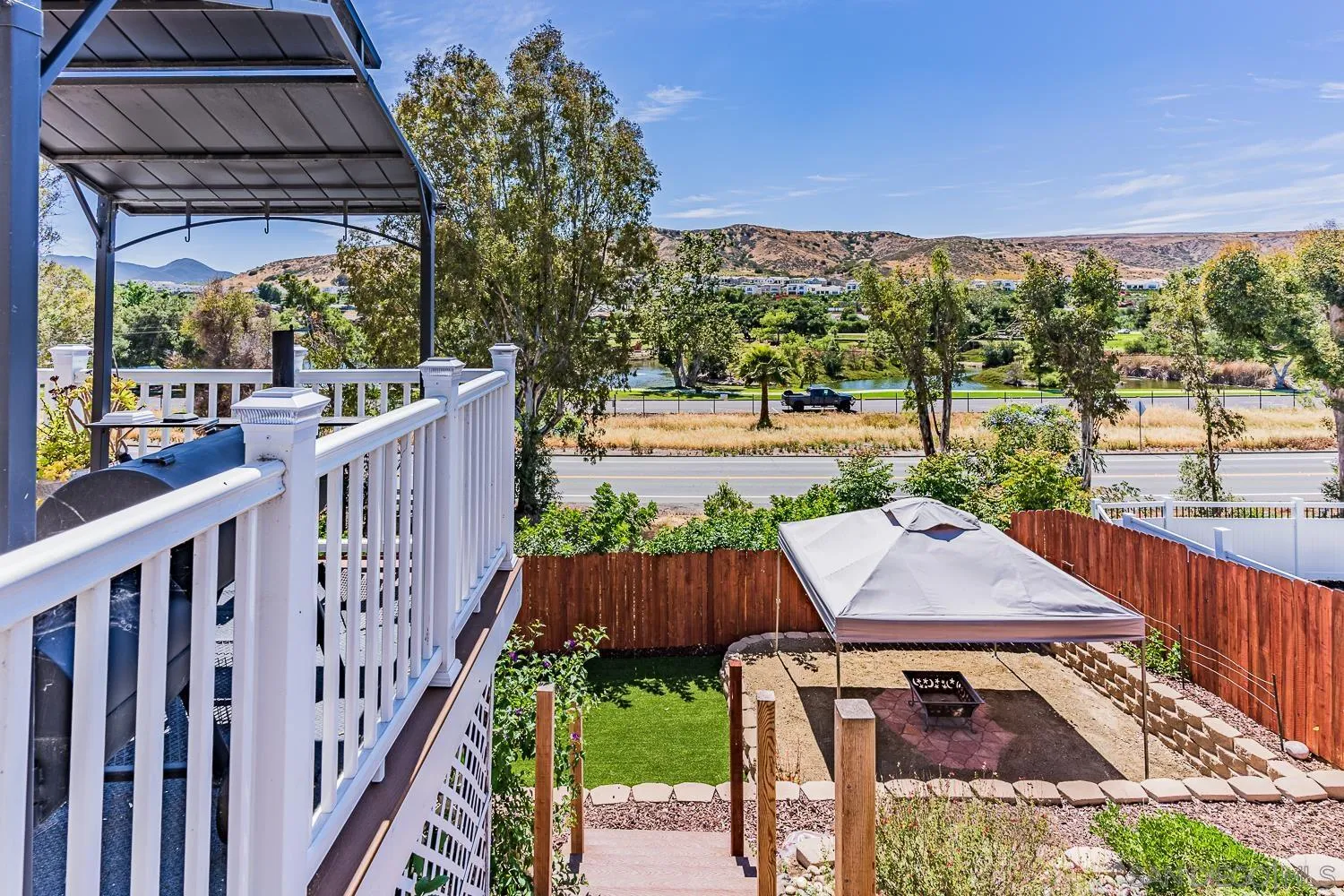 9213 Dalehurst Road Santee, CA 92071 - Photo 16 of 31 a view of a patio with a table and chairs under an umbrella