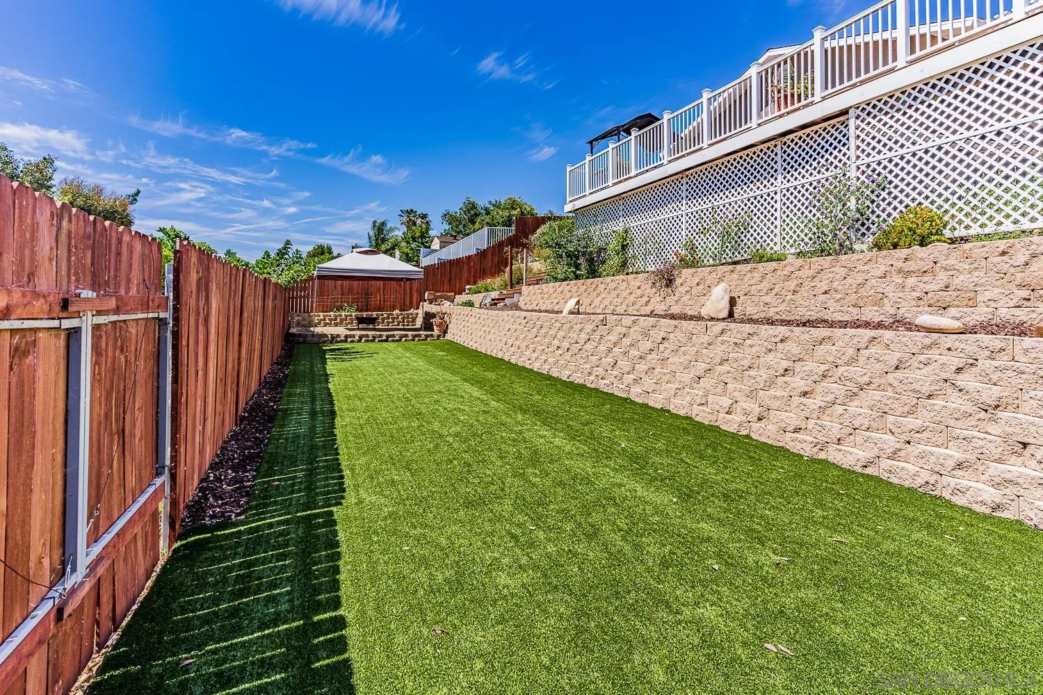 9213 Dalehurst Road Santee, CA 92071 - Photo 18 of 31 a view of a backyard with pathway