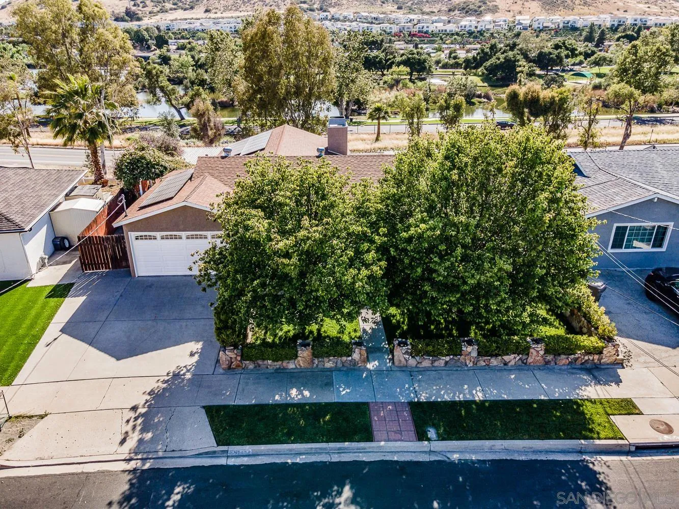 9213 Dalehurst Road Santee, CA 92071 - Photo 19 of 31 an aerial view of a house with a yard and lake view
