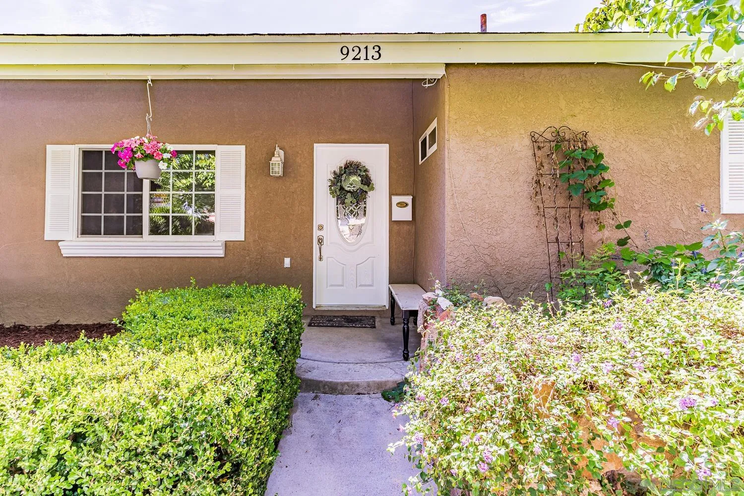 9213 Dalehurst Road Santee, CA 92071 - Photo 2 of 31 a front view of a house with a yard and fountain