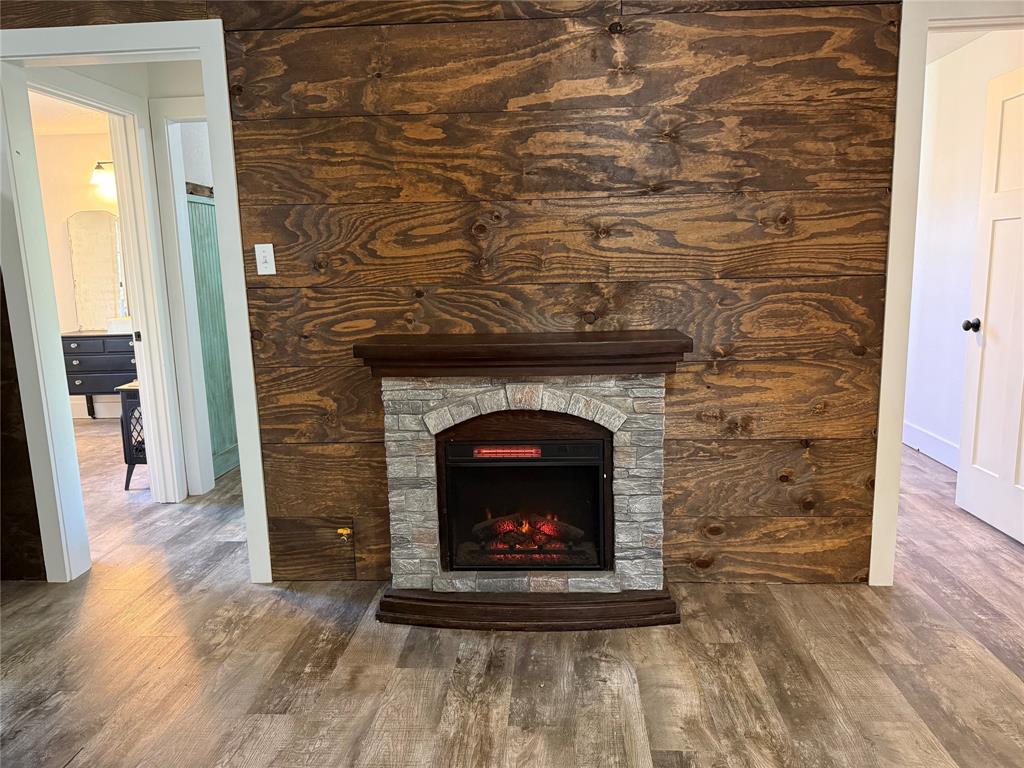 122 Tobacco Road Whitney, TX 76692 - Photo 11 of 35 a living room with a fireplace