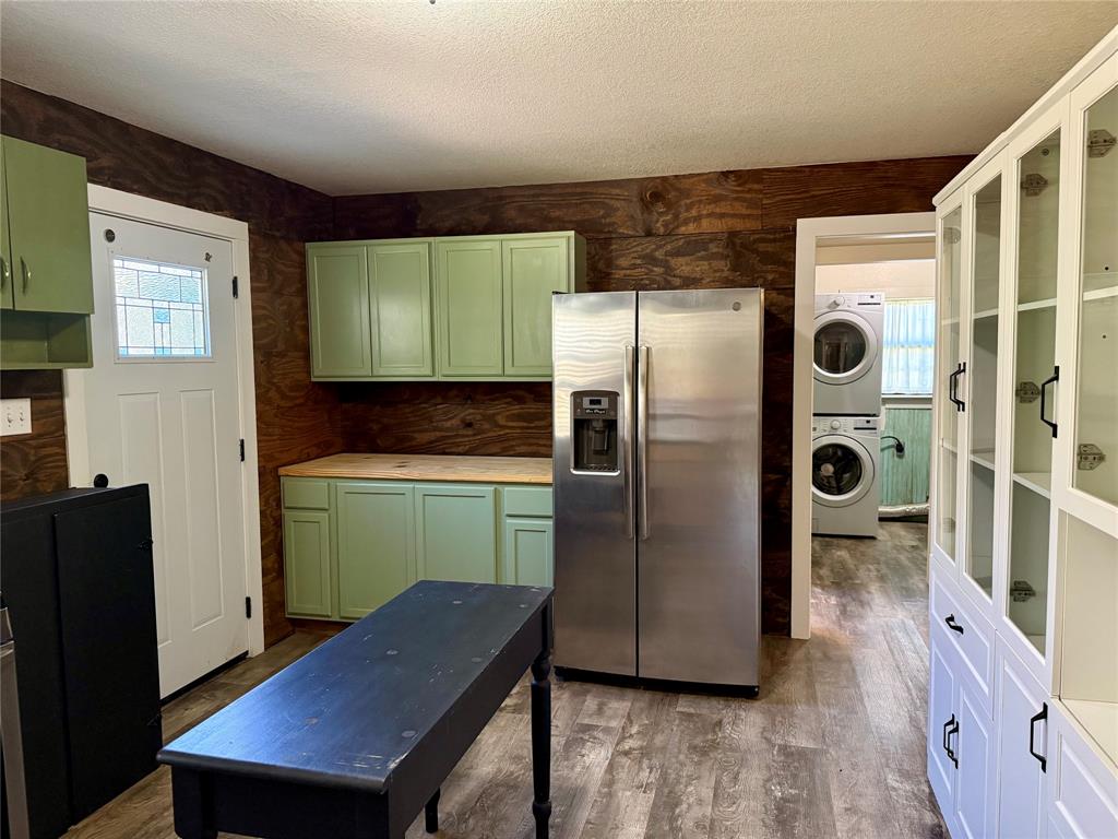 122 Tobacco Road Whitney, TX 76692 - Photo 13 of 35 a kitchen with stainless steel appliances granite countertop a refrigerator and a stove top oven