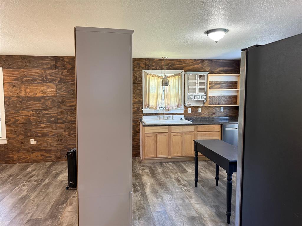 122 Tobacco Road Whitney, TX 76692 - Photo 20 of 35 a kitchen with a sink cabinets and window