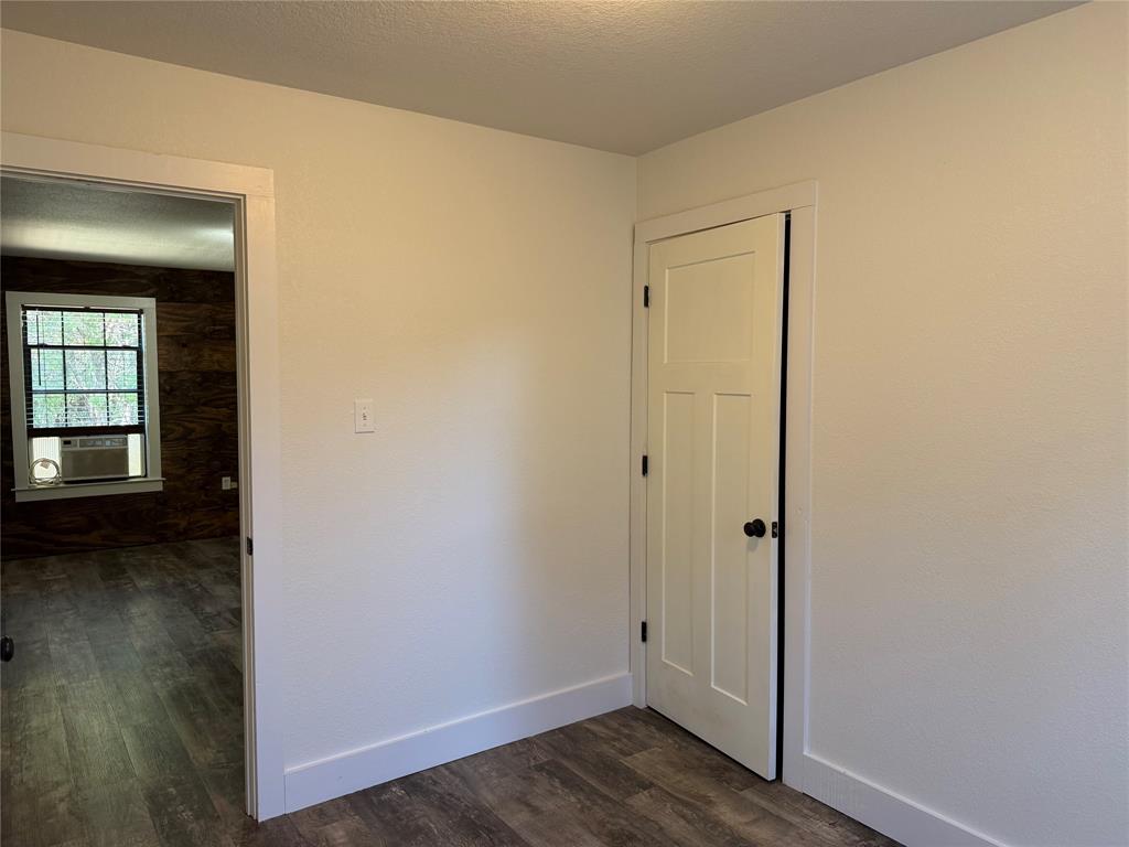 122 Tobacco Road Whitney, TX 76692 - Photo 23 of 35 a view of a hallway with wooden floor