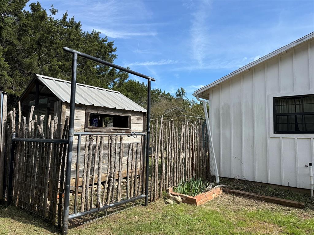 122 Tobacco Road Whitney, TX 76692 - Photo 26 of 35 a view of a house with wooden fence