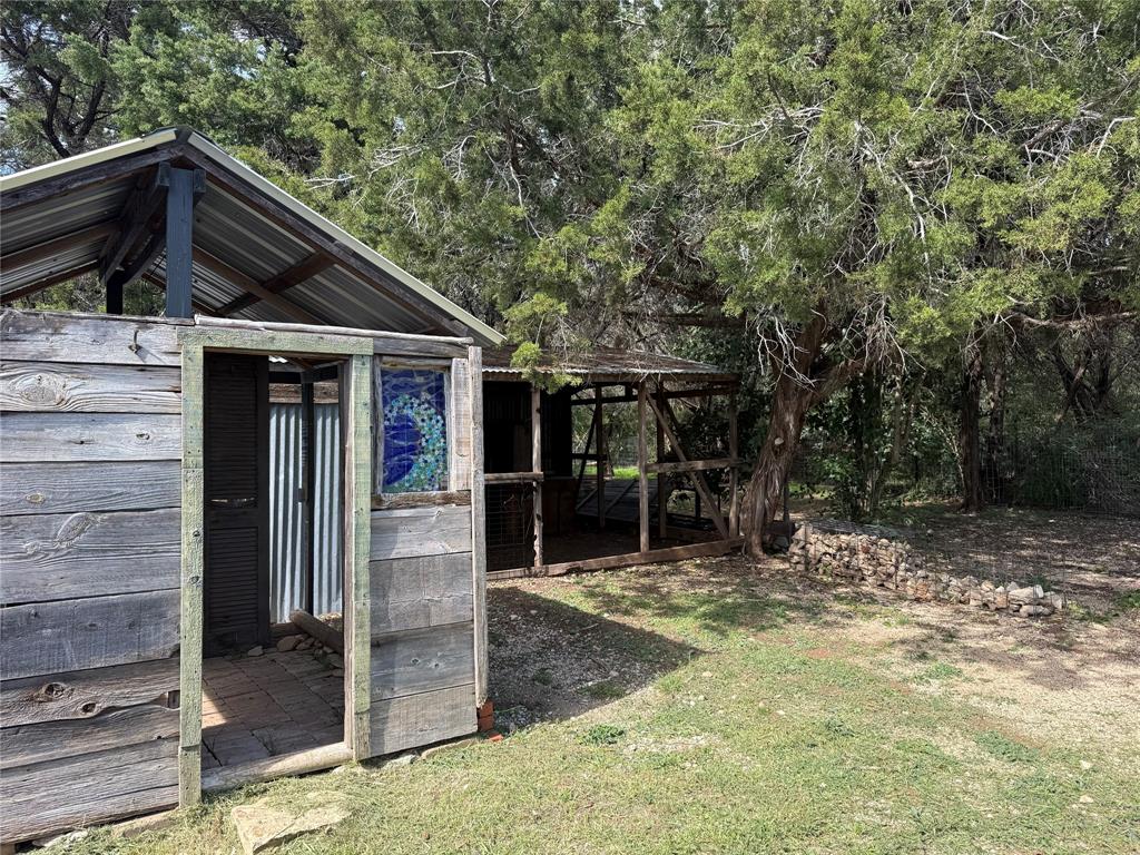 122 Tobacco Road Whitney, TX 76692 - Photo 28 of 35 a view of a house with a small yard