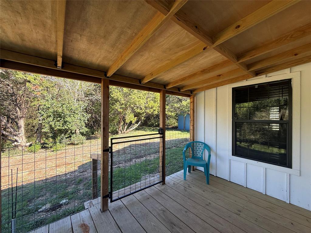 122 Tobacco Road Whitney, TX 76692 - Photo 3 of 35 a view of a porch with wooden floor and outdoor space