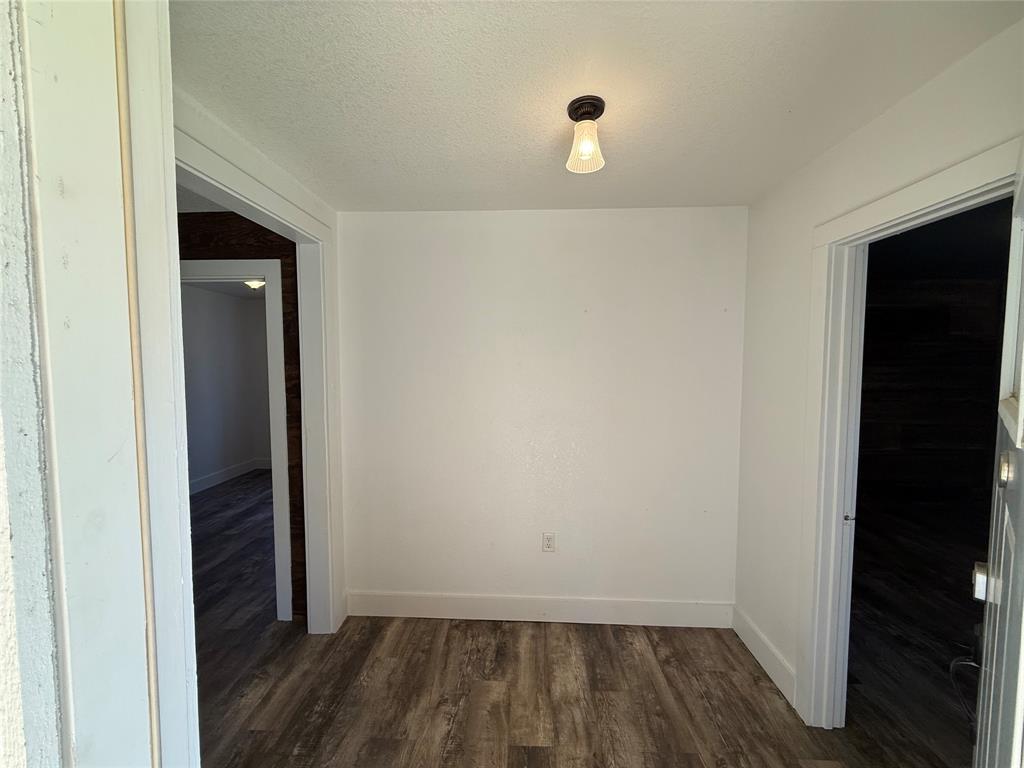 122 Tobacco Road Whitney, TX 76692 - Photo 4 of 35 a view of a livingroom with wooden floor