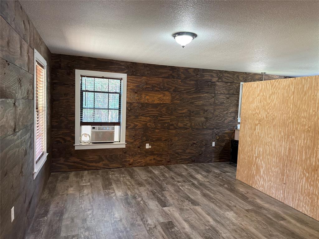 122 Tobacco Road Whitney, TX 76692 - Photo 10 of 35 an empty room with windows