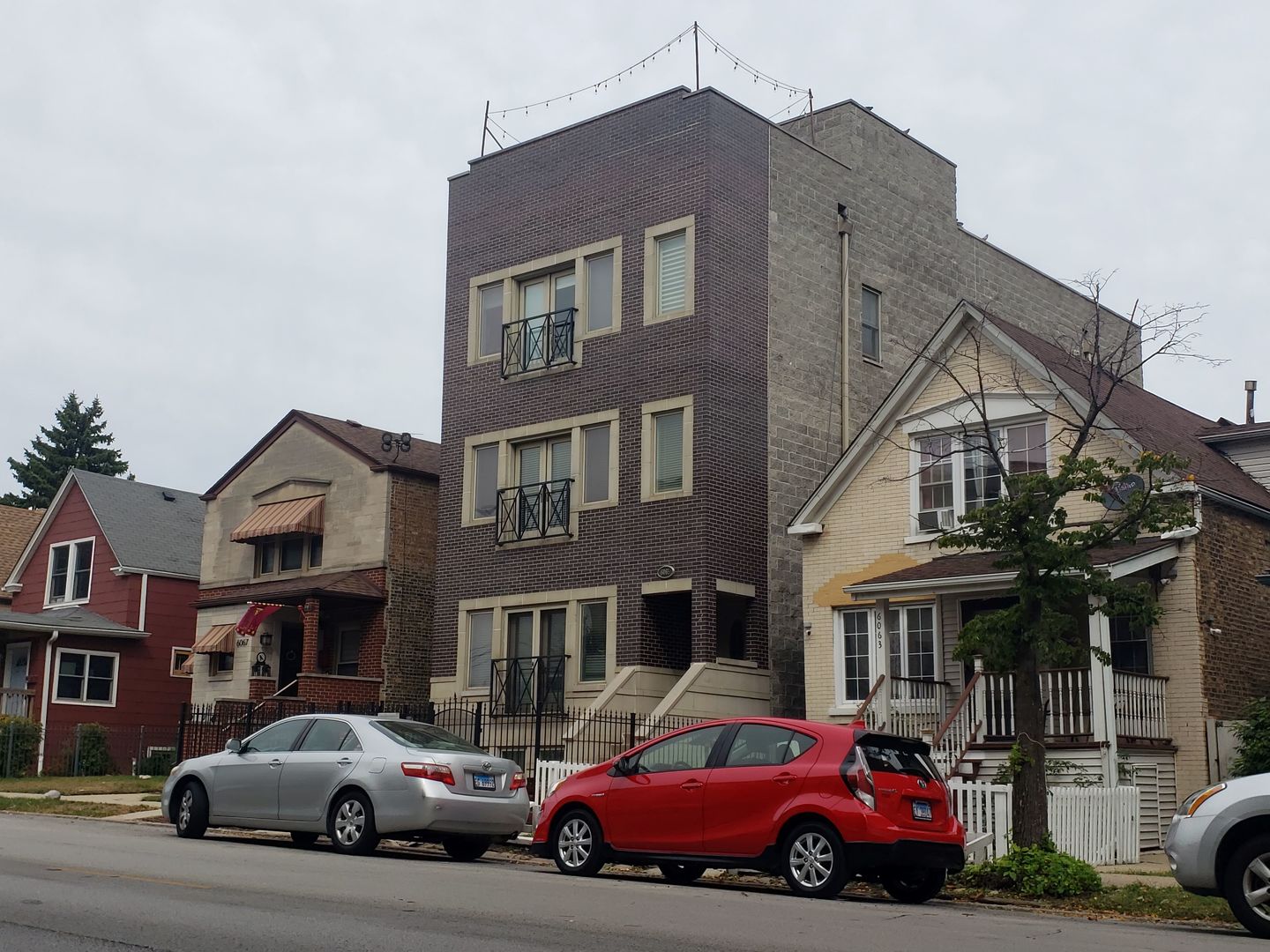 6065 North Ridge Avenue, Unit 2 Chicago, IL 60660 - Photo 1 of 17 a car parked in front of a house