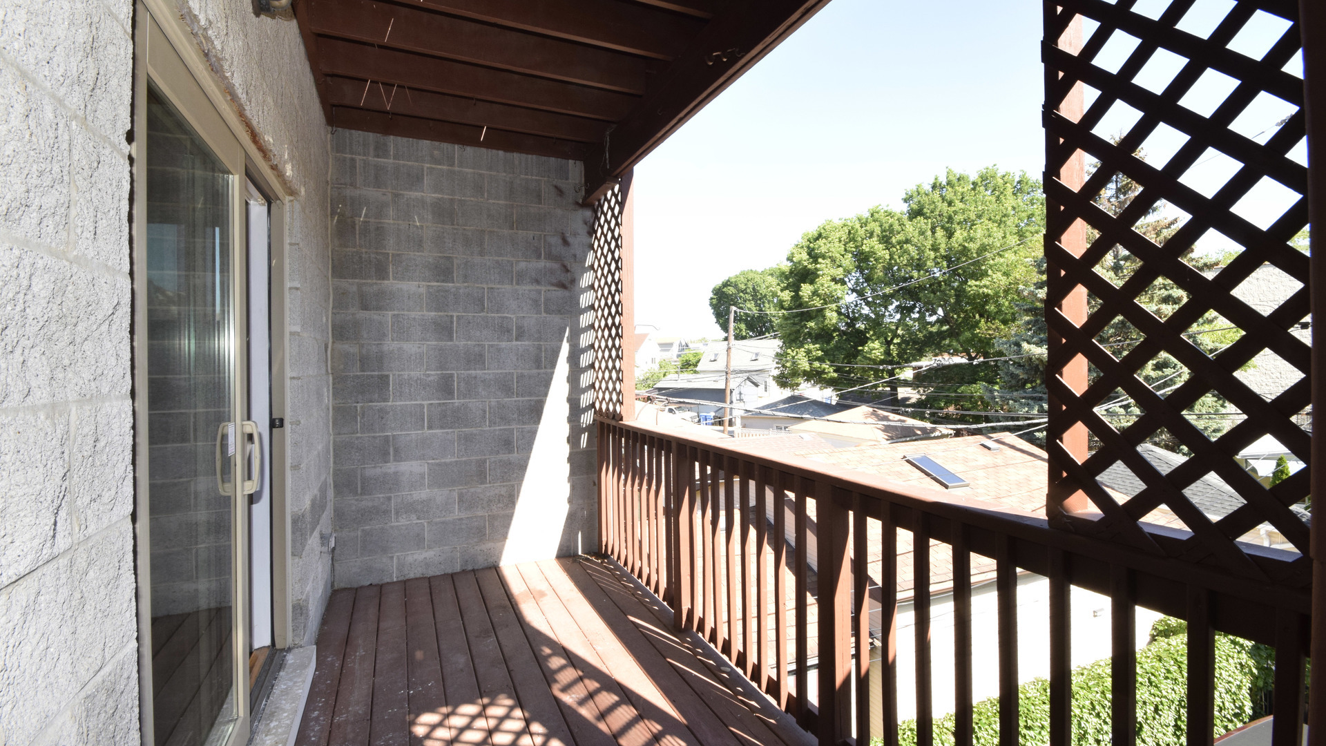 6065 North Ridge Avenue, Unit 2 Chicago, IL 60660 - Photo 15 of 17 a view of a balcony with wooden floor