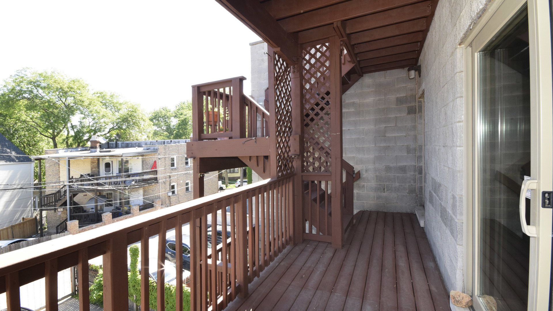 6065 North Ridge Avenue, Unit 2 Chicago, IL 60660 - Photo 16 of 17 a view of balcony with wooden floor and fence