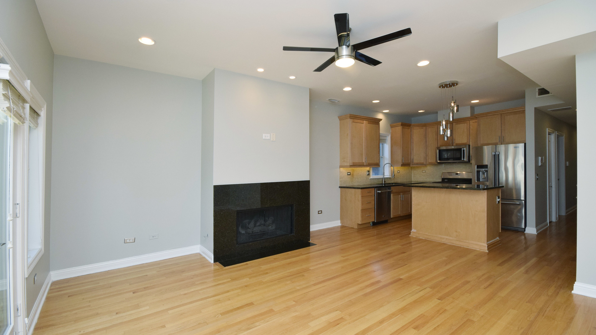 6065 North Ridge Avenue, Unit 2 Chicago, IL 60660 - Photo 4 of 17 a view of kitchen with refrigerator and microwave