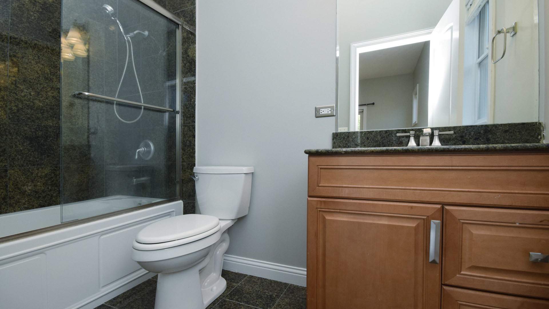6065 North Ridge Avenue, Unit 2 Chicago, IL 60660 - Photo 10 of 17 a bathroom with a toilet a sink and shower