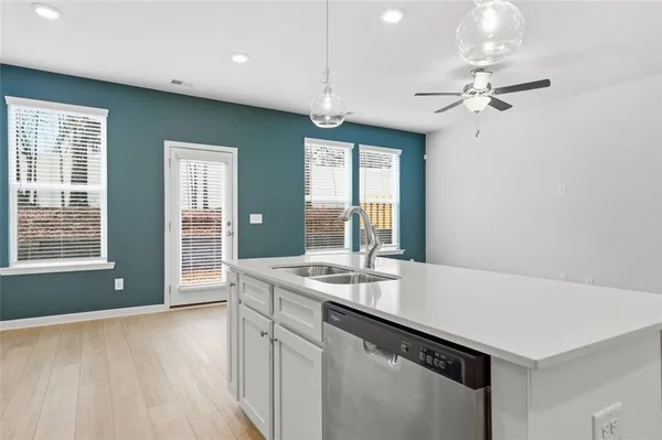 a room with a chandelier furniture and a chandelier