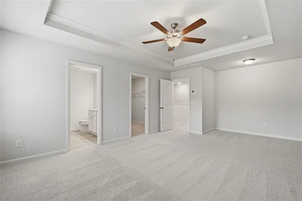 a bathroom with a double vanity sink toilet and a mirror