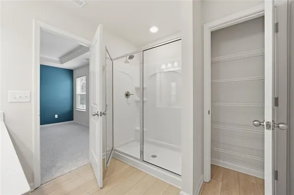 a bathroom with a sink double vanity and a mirror