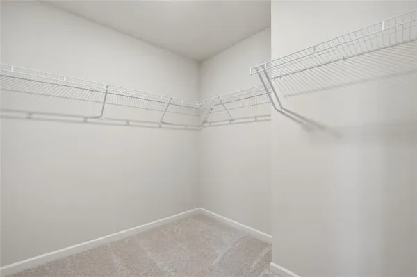 a view of a house with wooden fence