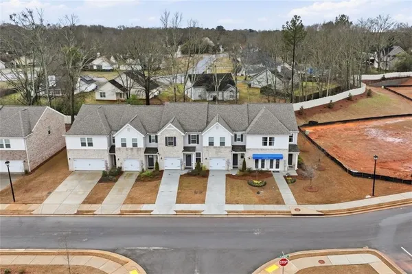 an aerial view of a house with a ocean view