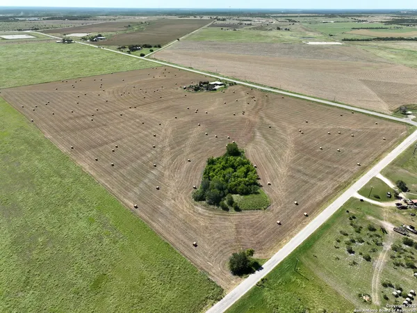 a view of a field with an outdoor space