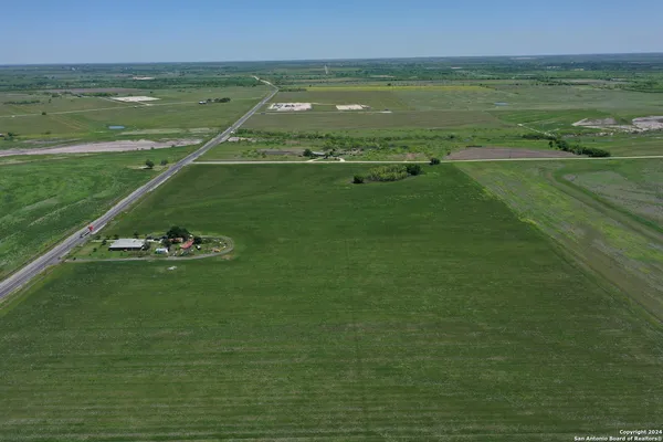a view of a lake with a yard