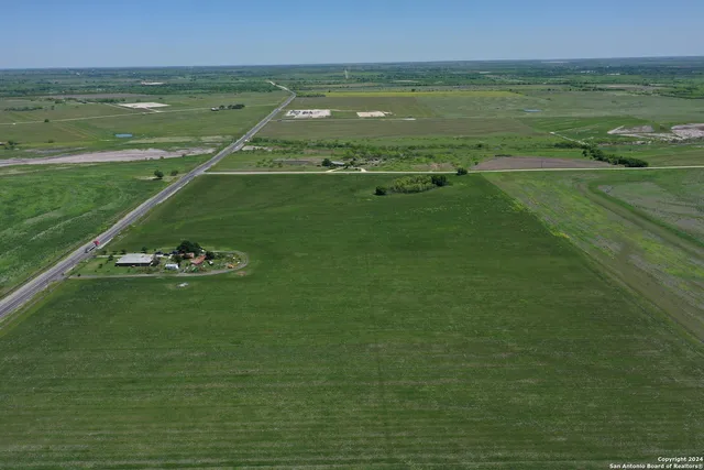 a view of a lake with a yard
