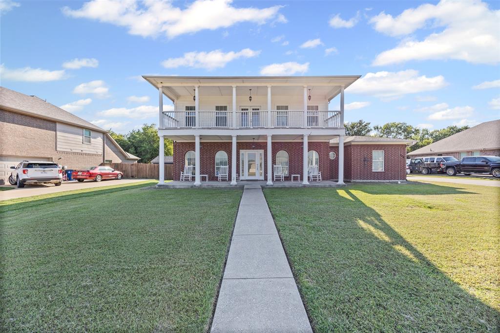 905 Royse Ridge Road Ennis, TX 75119 - Photo 2 of 38 a view of a house with a garden